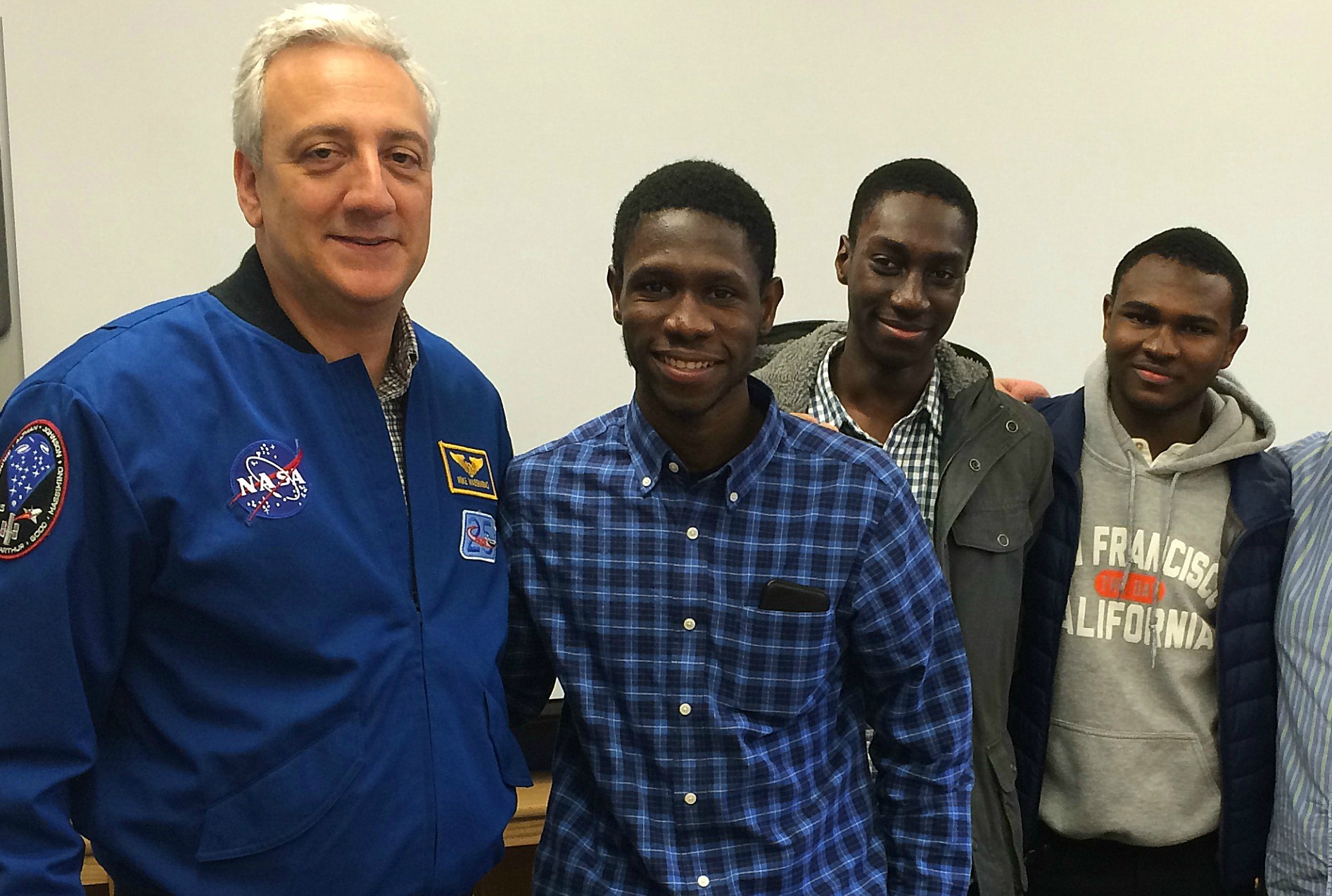 Professor and former NASA Astronaut Mike Massimino speaking with students from ELLIS Preparatory Academy.