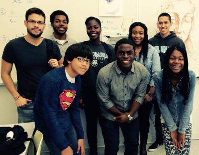NSBE members take a photo with a group of students. Photo Credit: Outreach Programs Staff NSBE members take a photo with a group of students