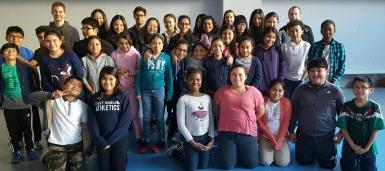 SHPE members take a picture with a group of students from East Harlem. Photo Credit: SHPE member SHPE members take a picture with a group of students from East Harlem.