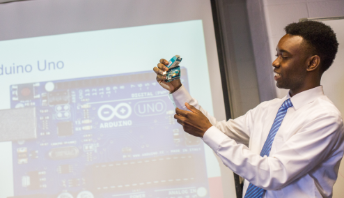 An E.N.G. student displays an arduino used in his research
